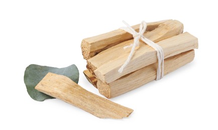 Photo of Palo santo sticks and eucalyptus leaf isolated on white