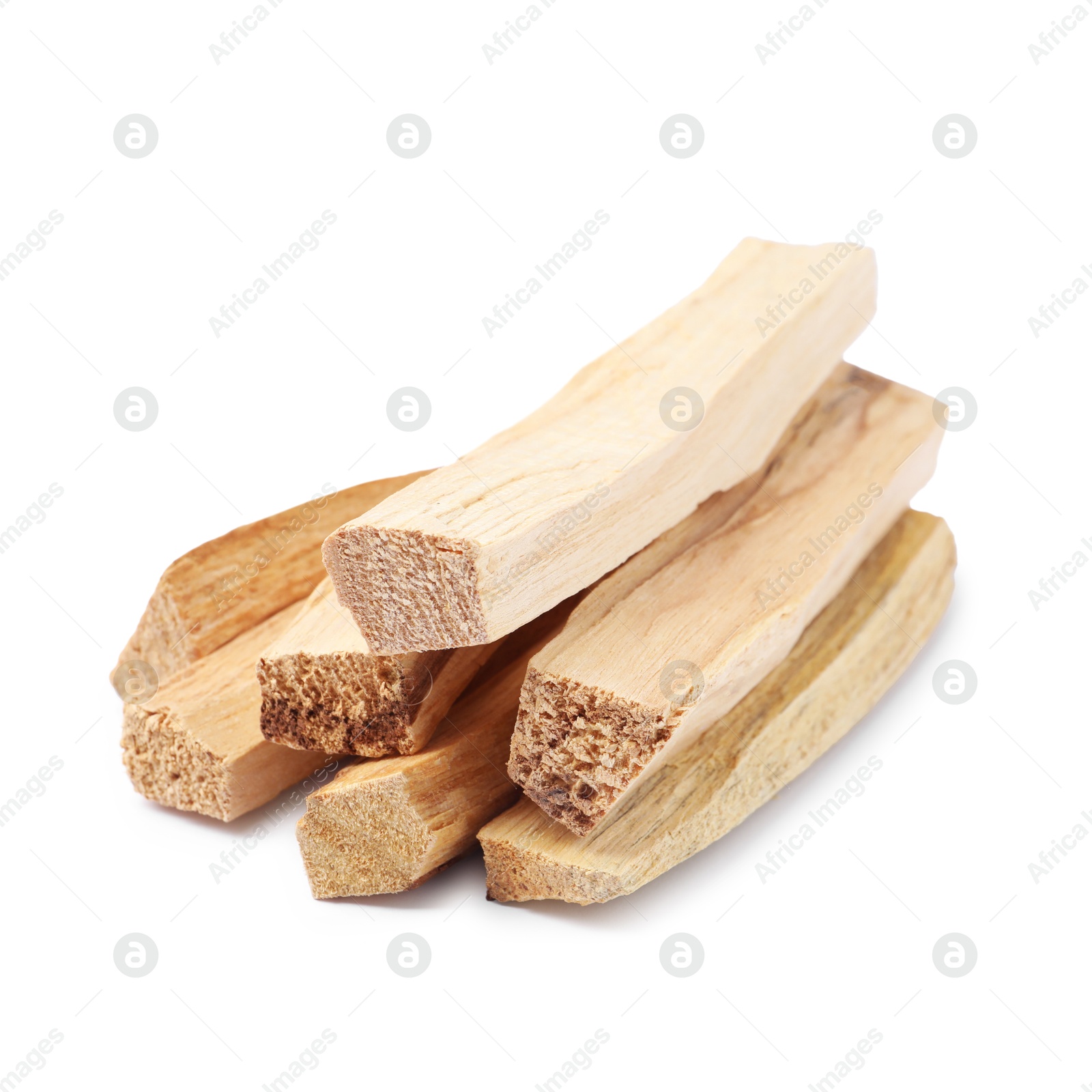 Photo of Pile of palo santo sticks isolated on white