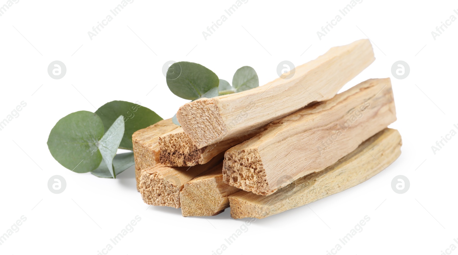 Photo of Palo santo sticks and eucalyptus leaves isolated on white