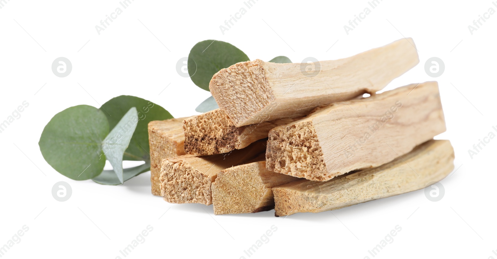 Photo of Palo santo sticks and eucalyptus leaves isolated on white