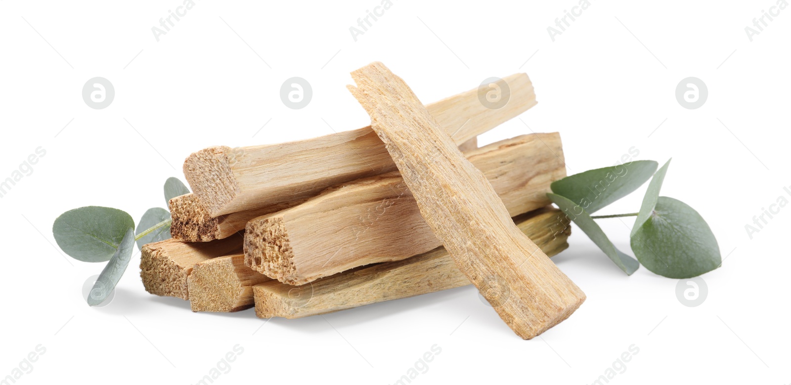 Photo of Palo santo sticks and eucalyptus leaves isolated on white