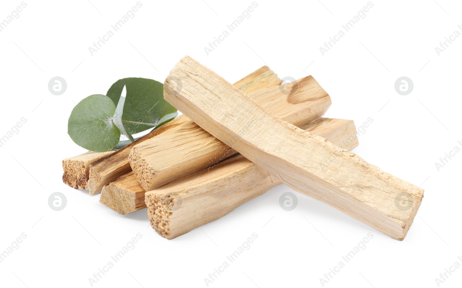 Photo of Palo santo sticks and eucalyptus leaves isolated on white