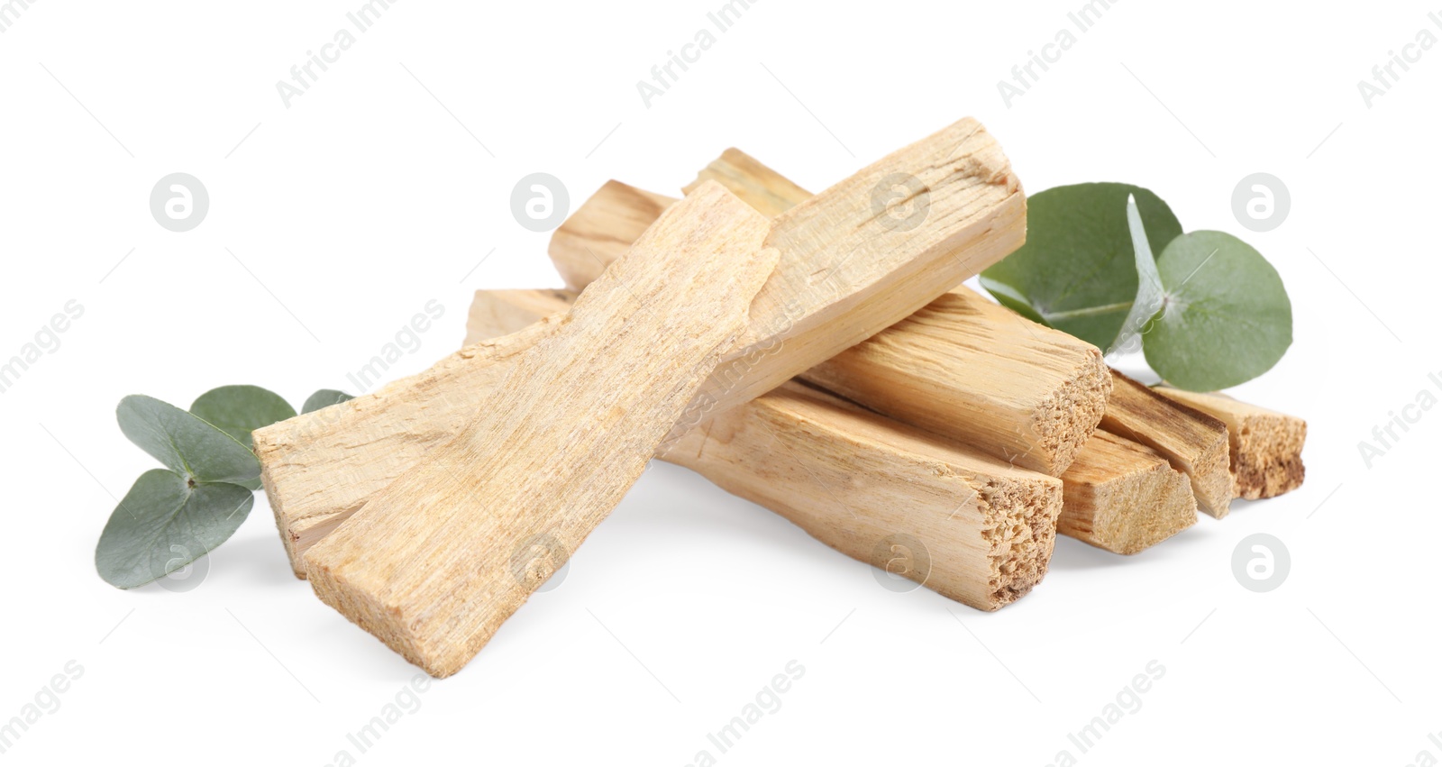 Photo of Palo santo sticks and eucalyptus leaves isolated on white