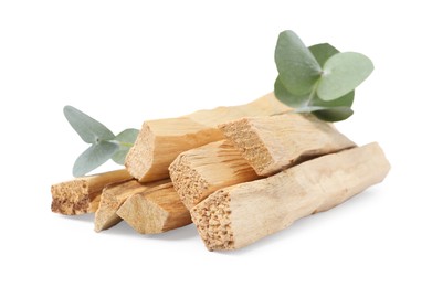 Photo of Palo santo sticks and eucalyptus branches isolated on white