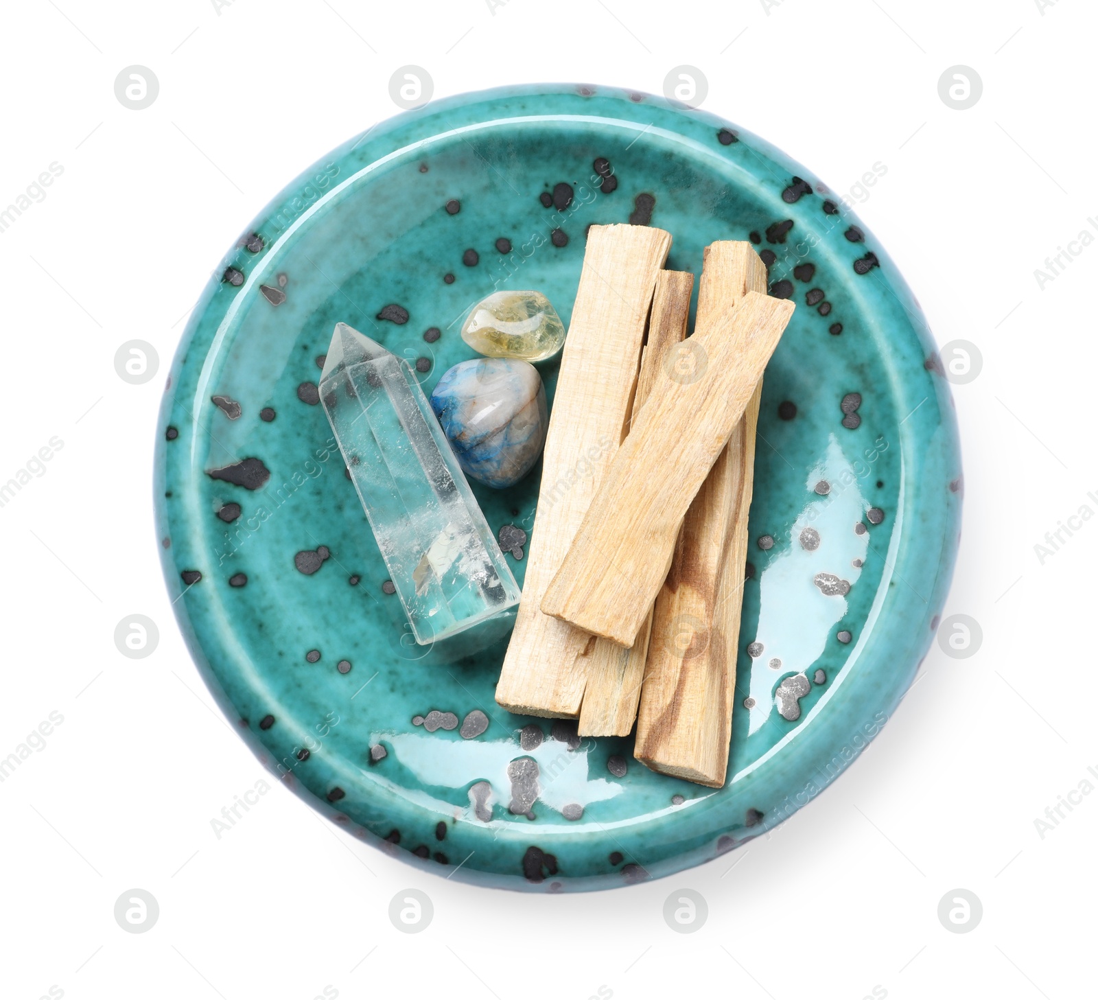 Photo of Palo santo sticks and gemstones isolated on white, top view