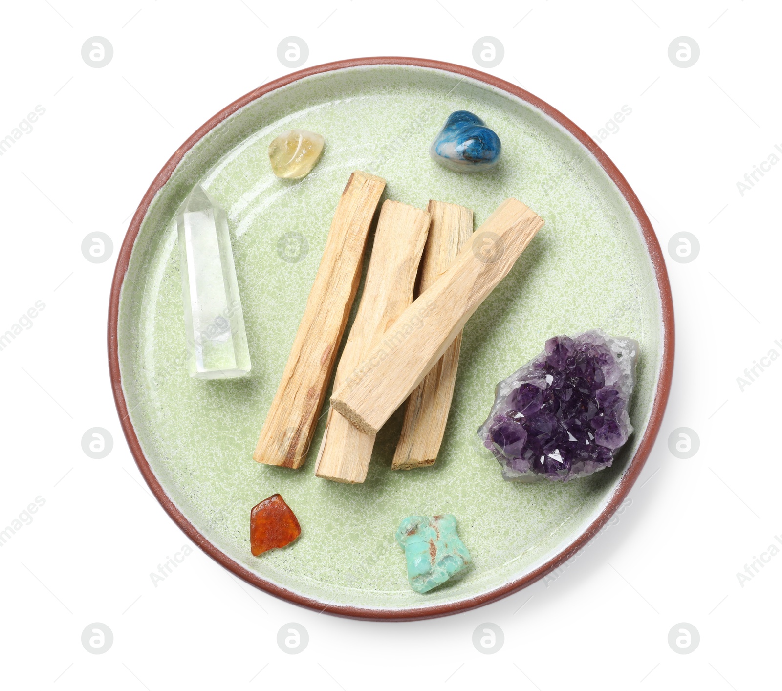 Photo of Palo santo sticks and gemstones isolated on white, top view