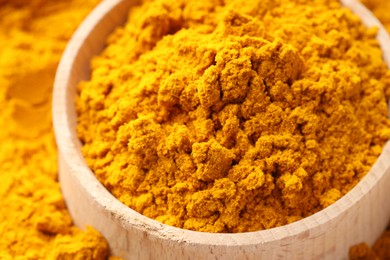 Photo of Turmeric powder in bowl on spice, closeup