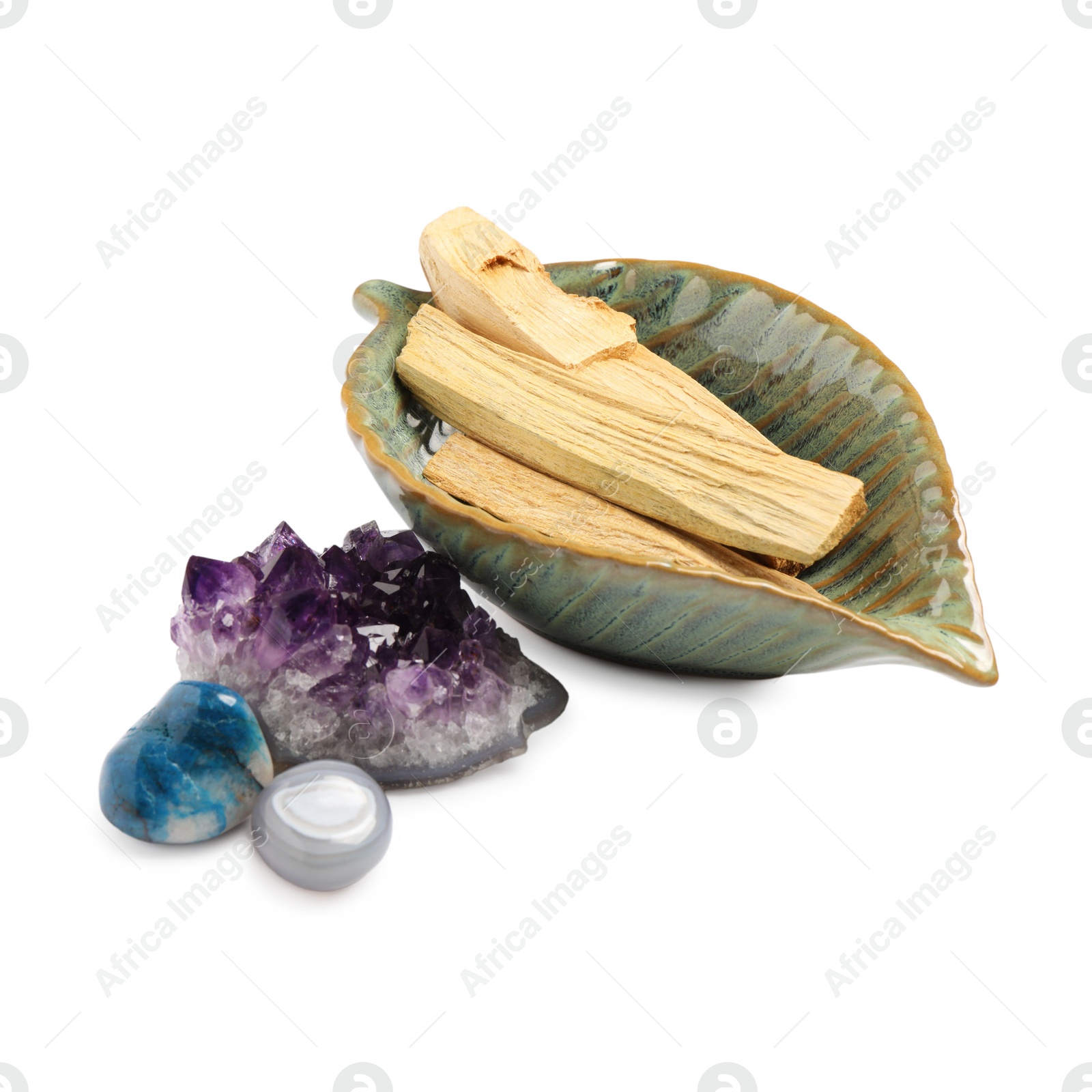 Photo of Palo santo sticks and gemstones isolated on white