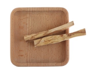 Photo of Palo santo sticks on white background, top view