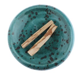 Photo of Palo santo sticks on white background, top view