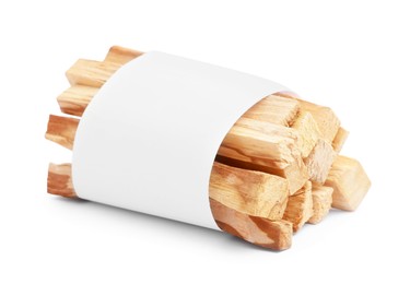 Photo of Palo santo sticks wrapped in paper on white background