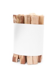 Palo santo sticks wrapped in paper on white background