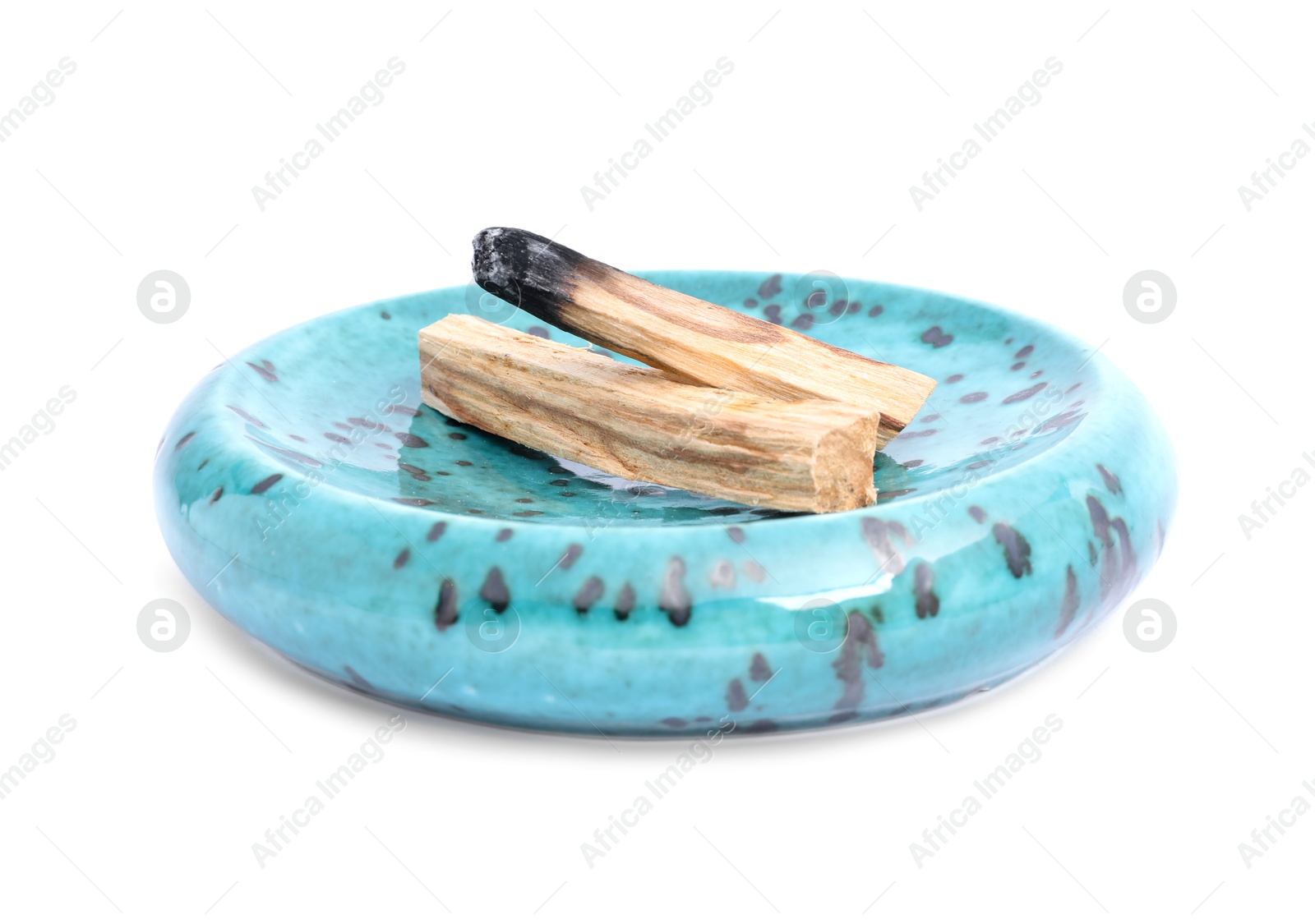 Photo of Whole palo santo stick and burnt one on white background