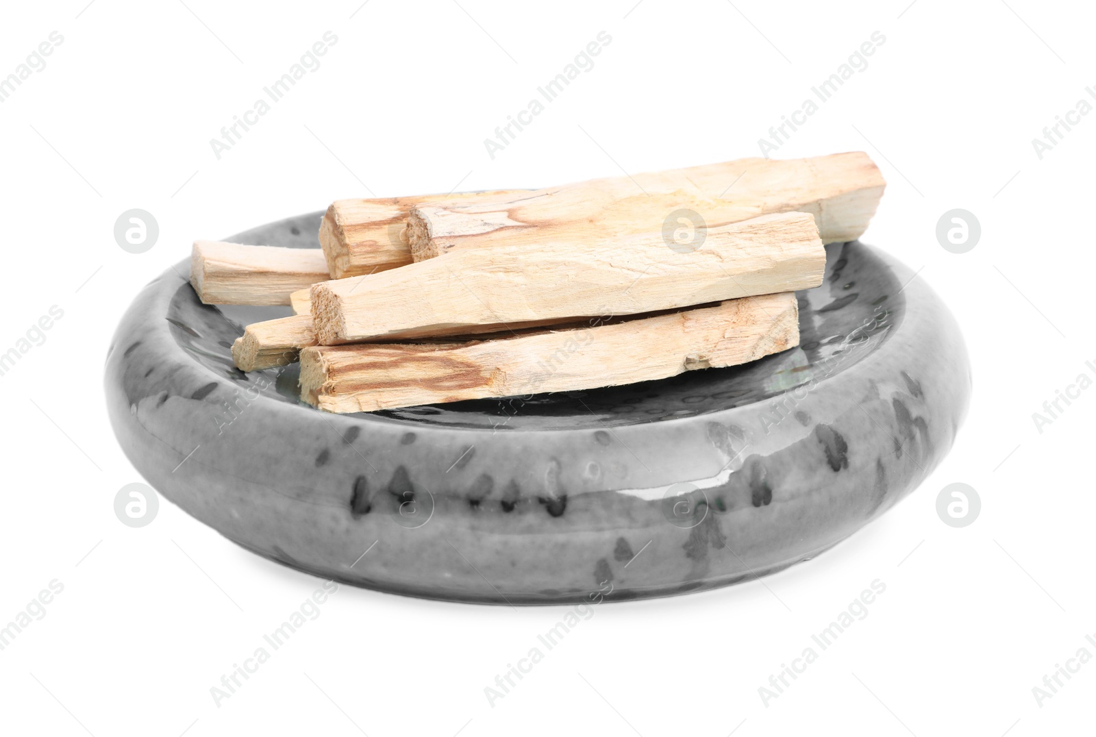 Photo of Many palo santo sticks on white background