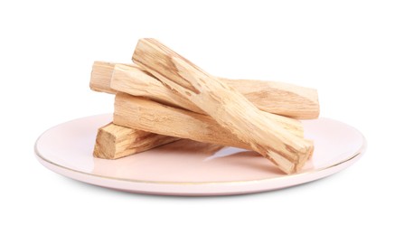 Pile of palo santo sticks on white background