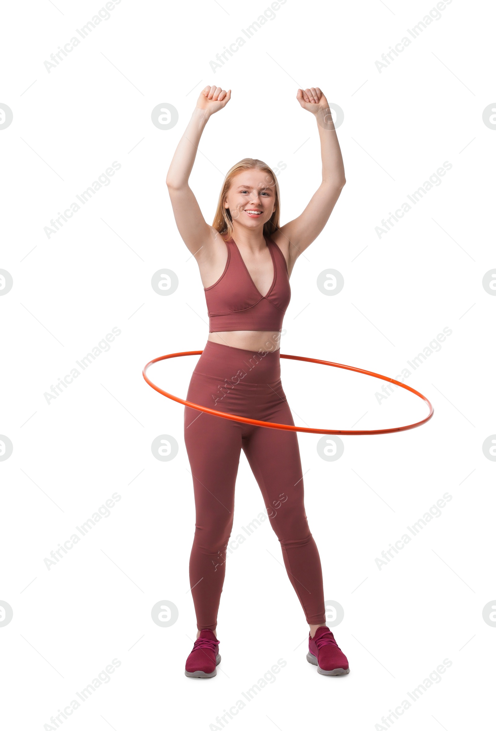 Photo of Beautiful young woman exercising with hula hoop on white background