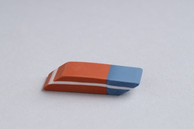 Photo of One eraser on grey background, closeup view