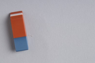 Photo of One eraser on grey background, top view. Space for text