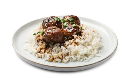 Photo of Delicious rice with meatballs, sauce and green onions isolated on white