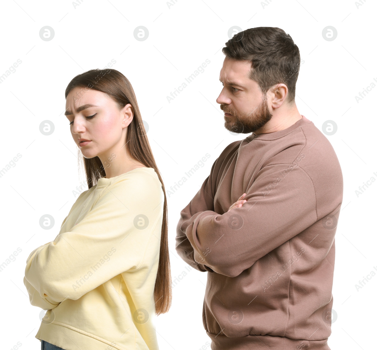 Photo of Resentful couple with crossed arms on white background