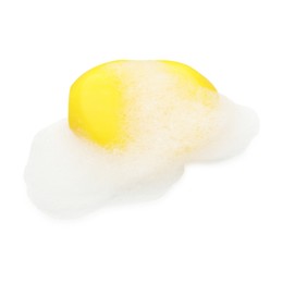 Photo of Yellow soap with foam on white background, top view