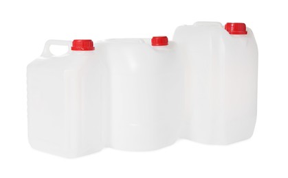 Photo of Three plastic canisters with caps isolated on white