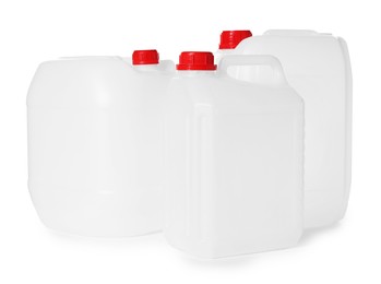 Photo of Three plastic canisters with caps isolated on white