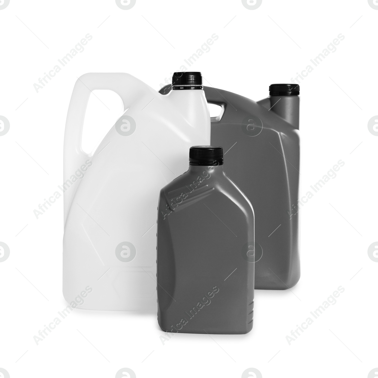 Photo of Three plastic canisters with caps isolated on white