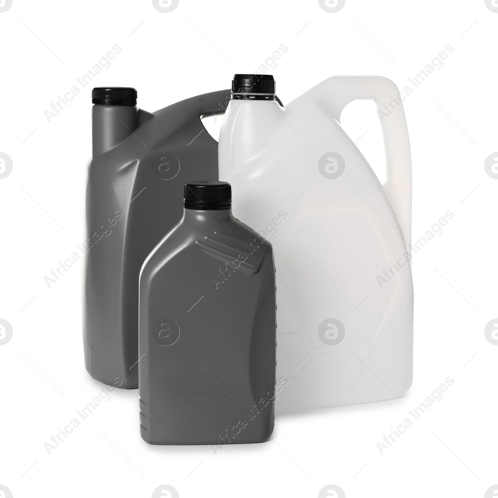 Photo of Three plastic canisters with caps isolated on white