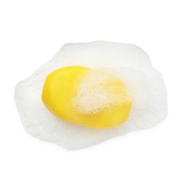 Photo of Yellow soap with foam on white background, top view