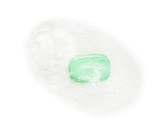 Photo of Green soap with foam on white background, top view