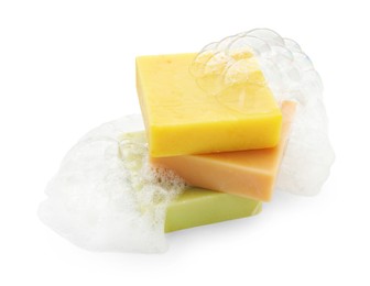 Photo of Stack of soap bars with foam on white background