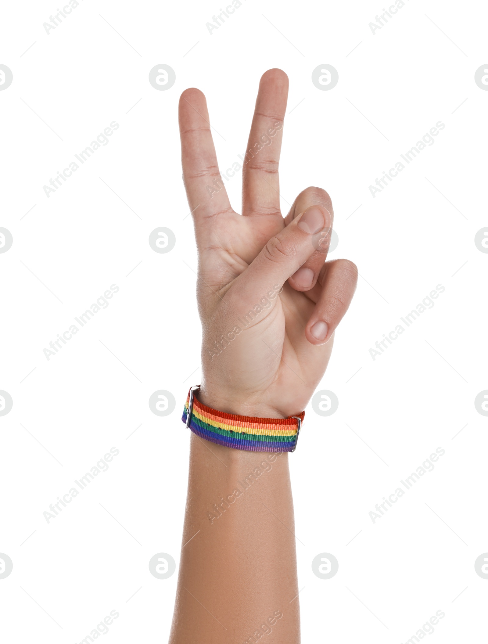 Photo of Man with bracelet in colors of LGBT flag showing peace sign on white background, closeup