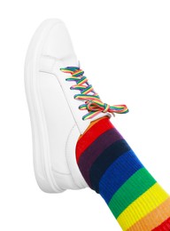 Photo of Woman wearing sock in LGBT colors on white background, closeup