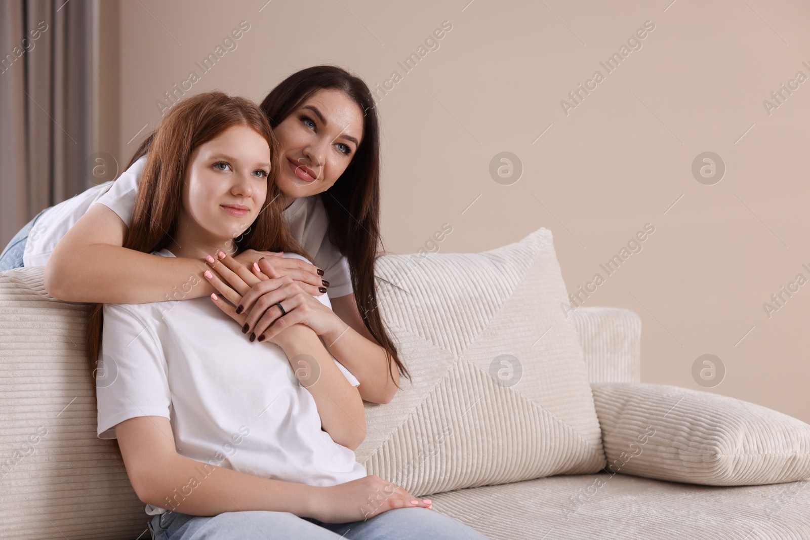 Photo of Portrait of beautiful mother with teenage daughter at home