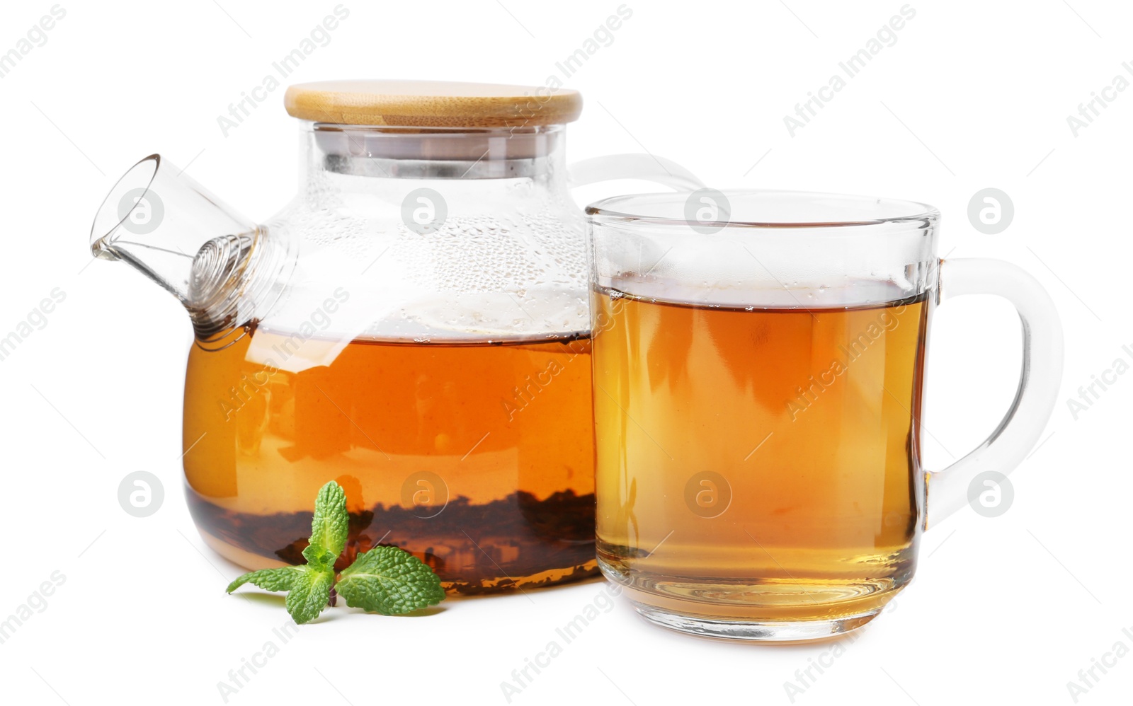 Photo of Tasty mint tea and fresh leaves isolated on white