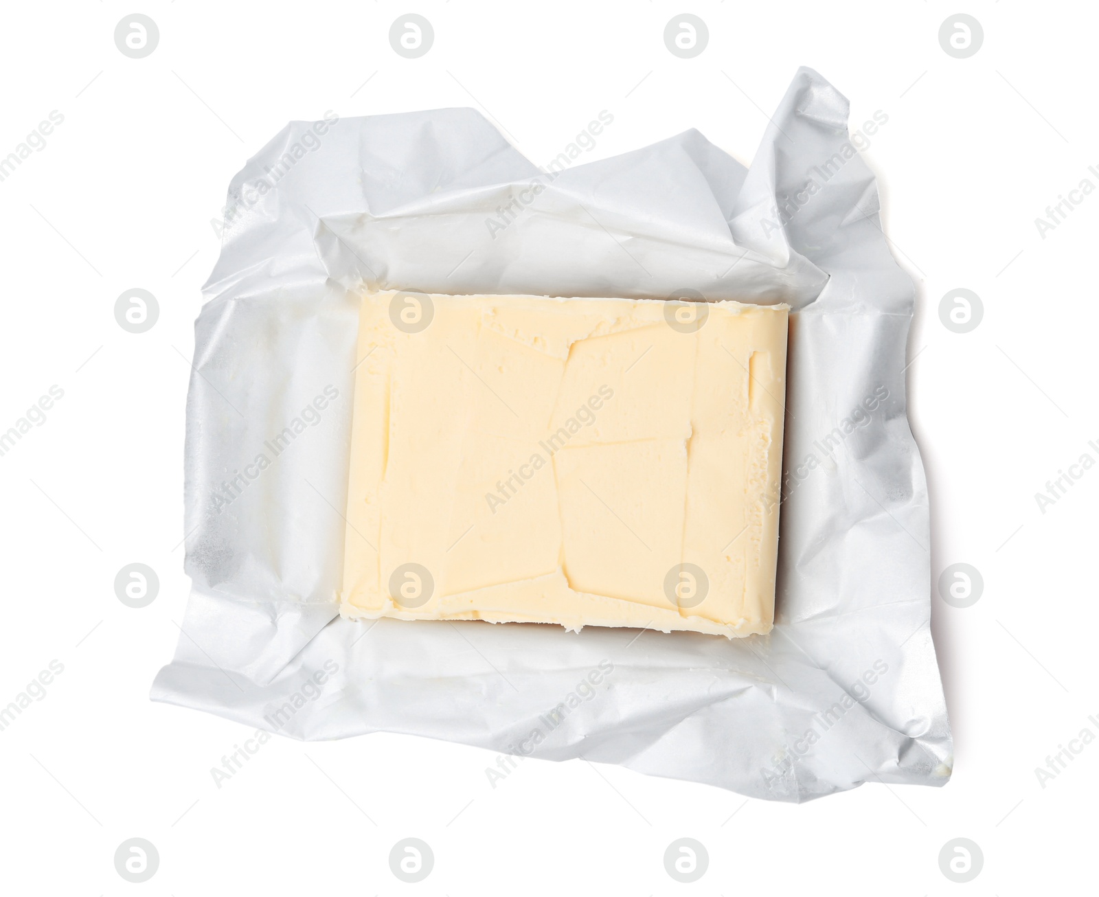 Photo of Block of tasty butter in open package isolated on white, top view