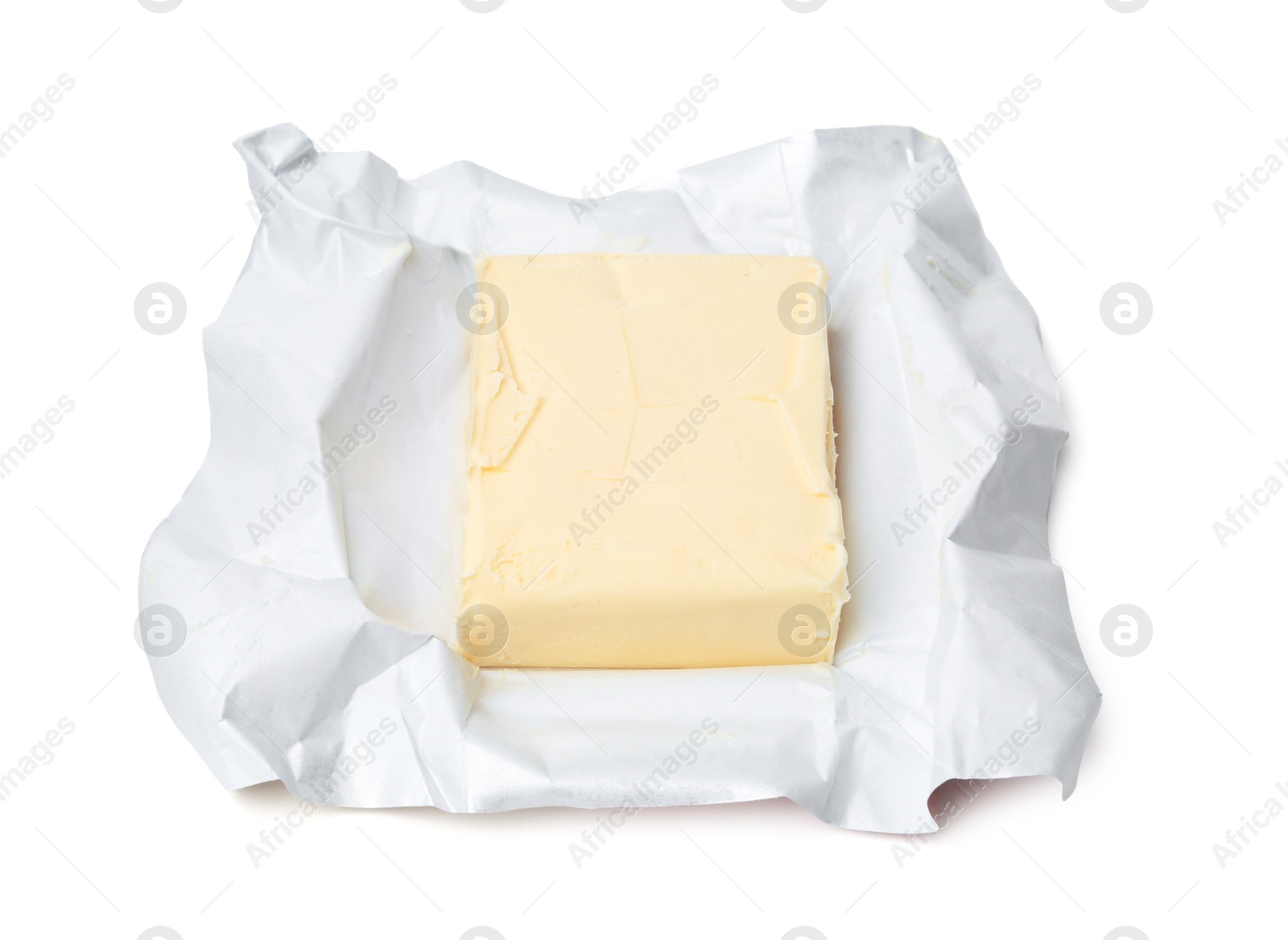 Photo of Block of tasty butter in open package isolated on white