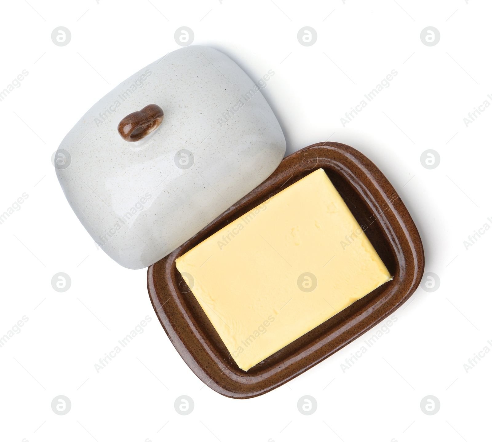 Photo of Block of tasty butter in dish isolated on white, top view