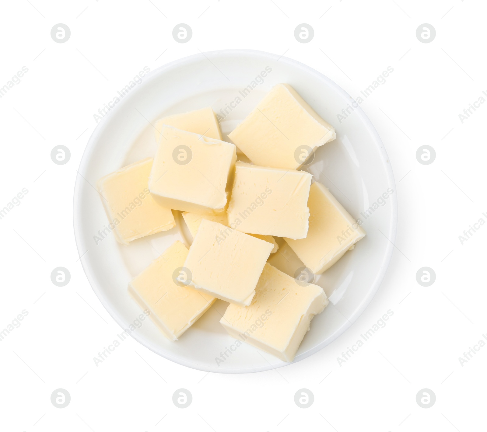 Photo of Pieces of fresh butter isolated on white, top view