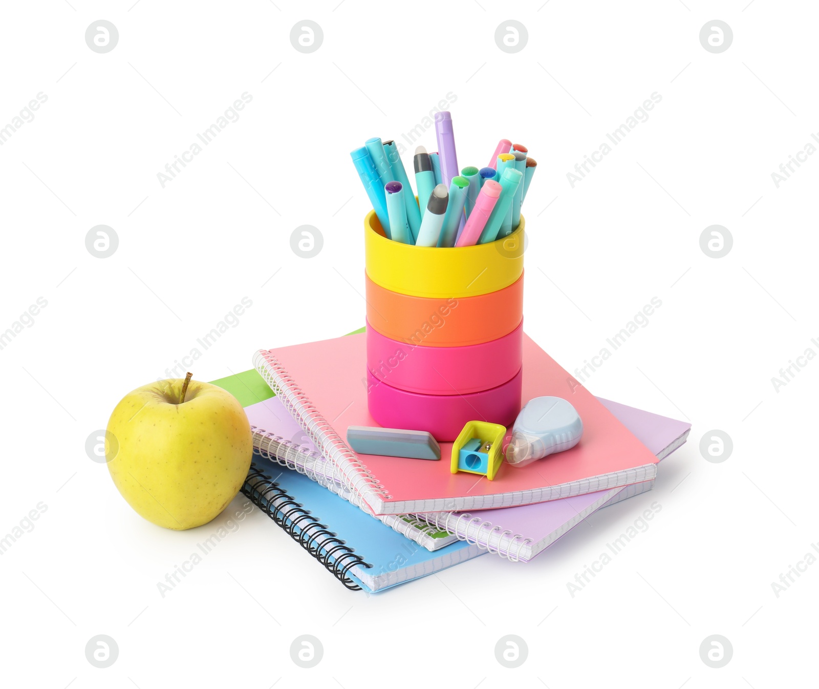 Photo of Doing homework. Notebooks, apple and stationery on white background