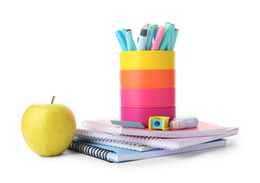 Photo of Doing homework. Notebooks, apple and stationery on white background