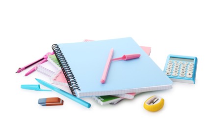 Photo of Doing homework. Notebooks and other different stationery on white background