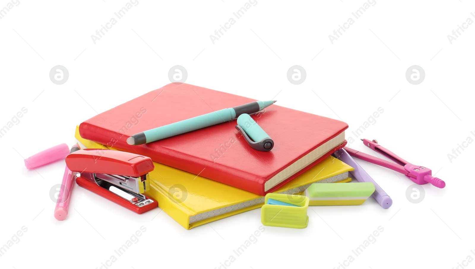 Photo of Doing homework. Notebooks and other different stationery on white background