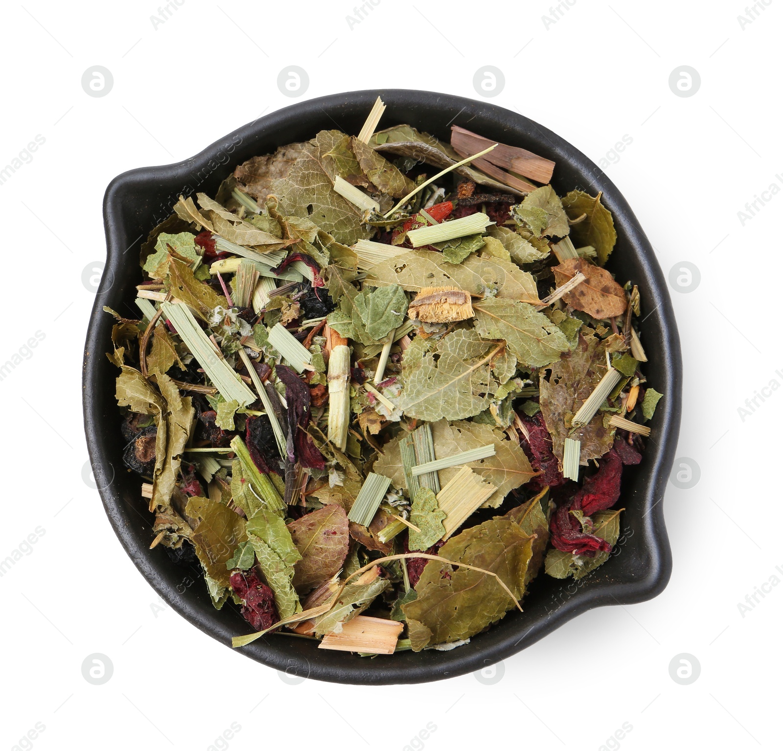 Photo of Dry herbal tea brew in bowl isolated on white, top view