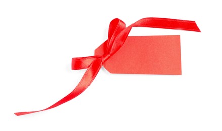 Photo of Blank tag with ribbon bow isolated on white