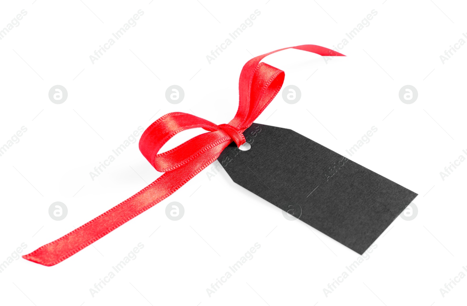 Photo of Blank tag with ribbon bow isolated on white