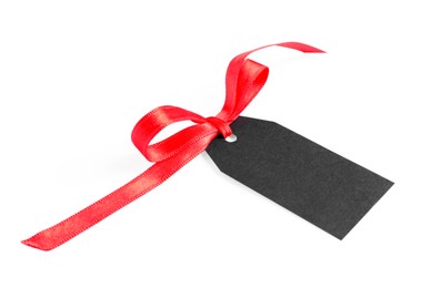 Photo of Blank tag with ribbon bow isolated on white