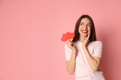 Photo of Happy Valentine's Day. Beautiful woman with paper hearts on pink background. Space for text