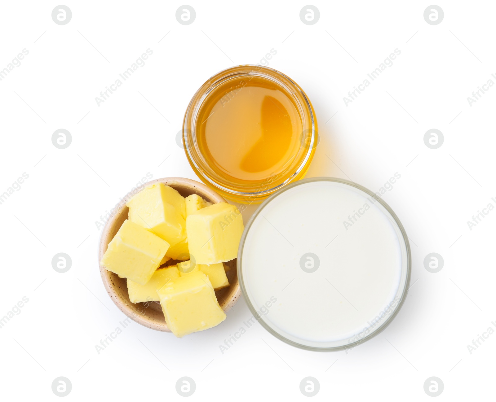 Photo of Sweet honey, butter and milk isolated on white, top view